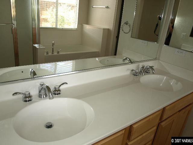 10532 Iron Point Circle Reno, NV 89521 - Photo 5 of 6 a bathroom with a sink and a mirror