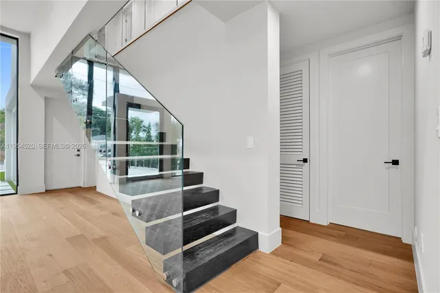 a view of wooden floor and windows in a room