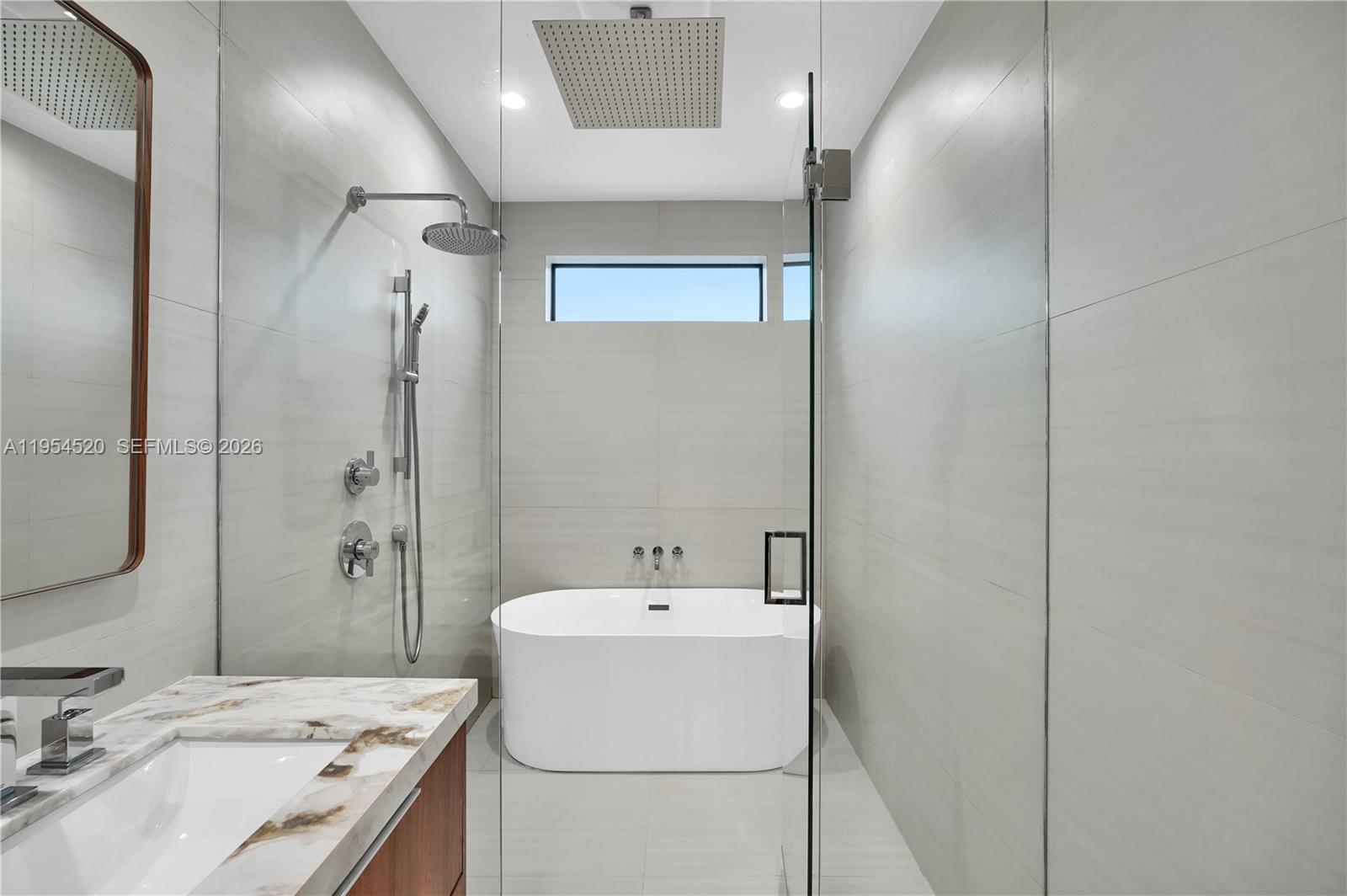 229 Northwest 42nd Street Miami, FL 33127 - Photo 25 of 37 a bathroom with a sink a toilet and shower
