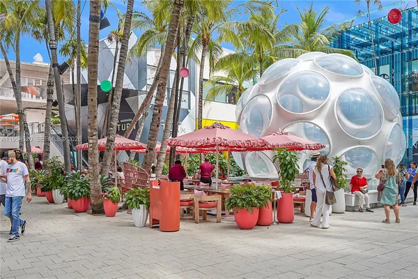 an outdoor space with lots of fruit and vegetables