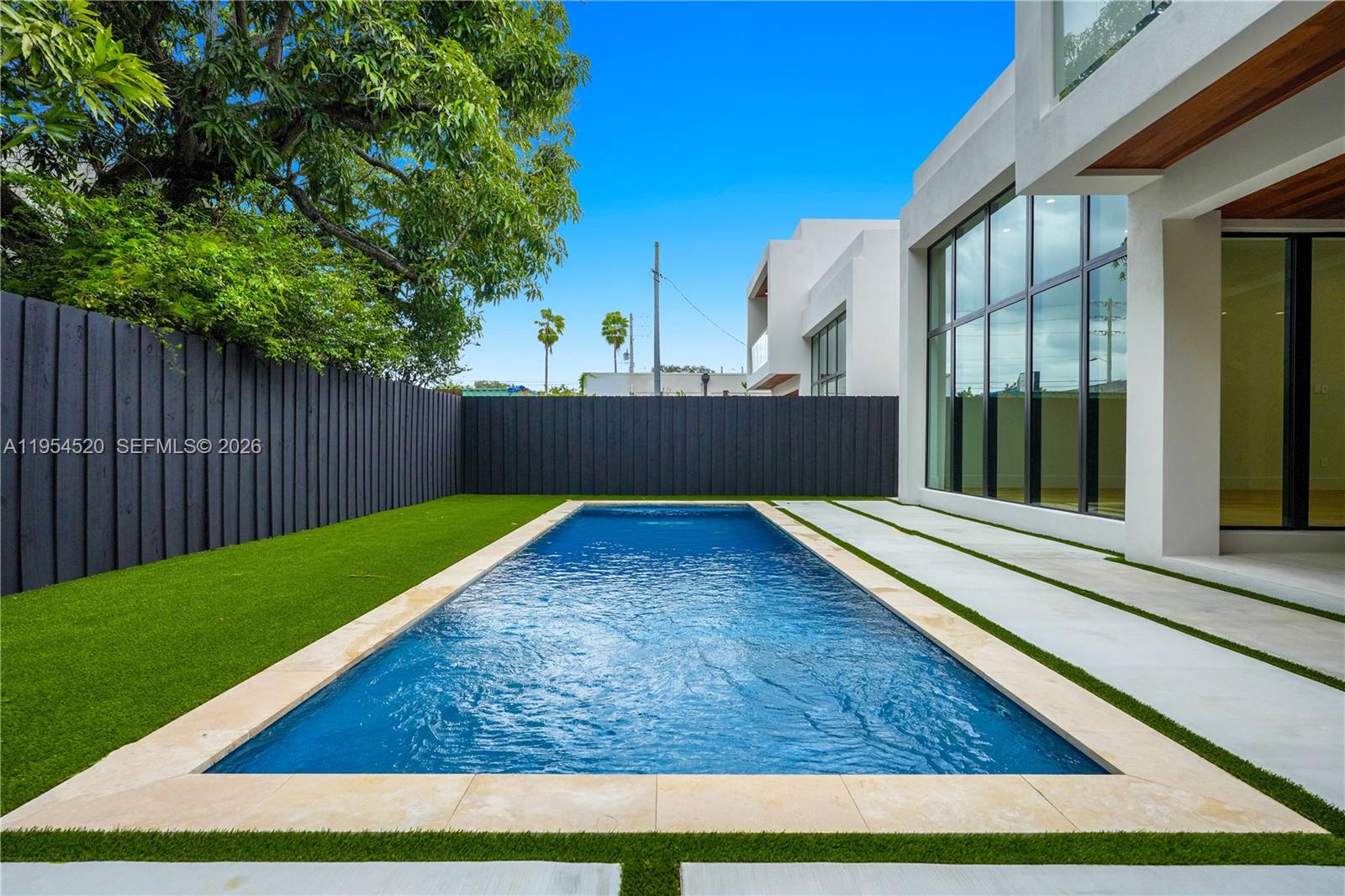 229 Northwest 42nd Street Miami, FL 33127 - Photo 9 of 37 a view of backyard with green space