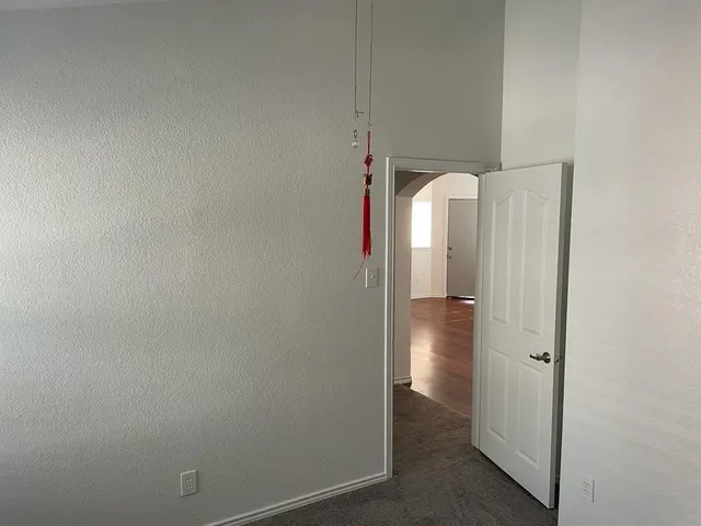 a bathroom with a granite countertop bathtub shower and toilet