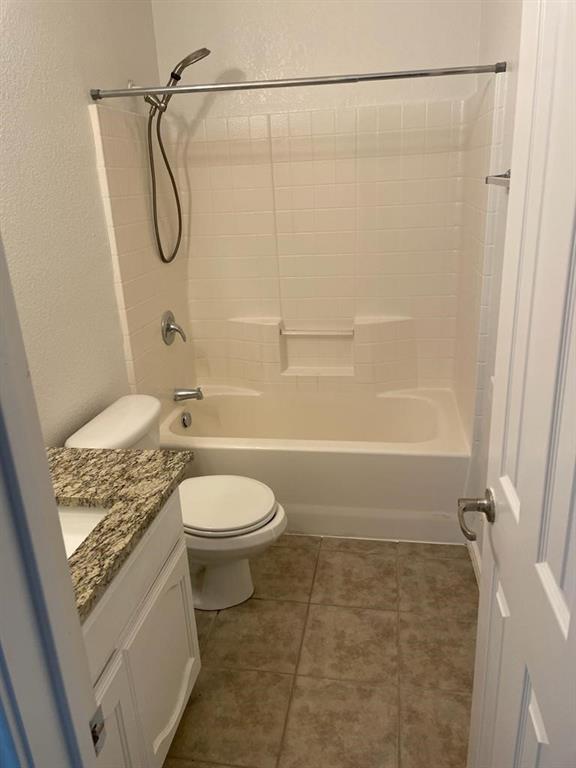 6324 Geneva Lane Fort Worth, TX 76131 - Photo 18 of 18 a bathroom with a granite countertop bathtub shower and toilet
