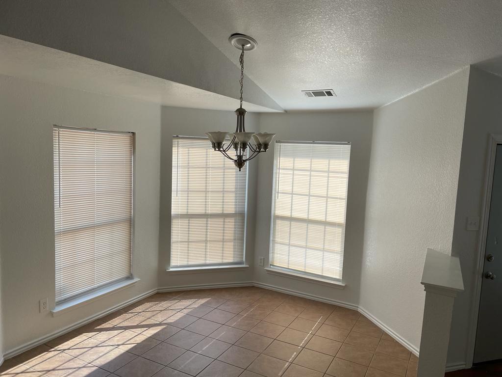 6324 Geneva Lane Fort Worth, TX 76131 - Photo 5 of 18 a view of an empty room with a window