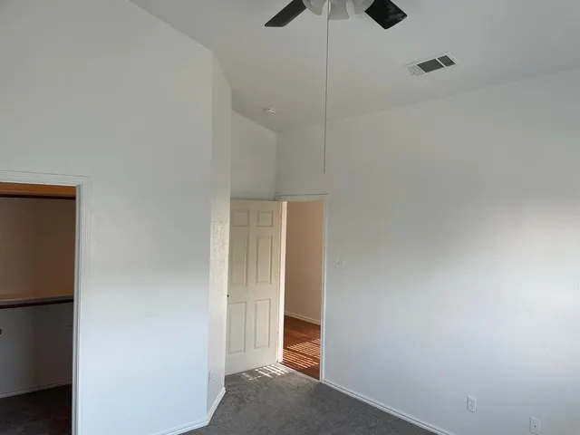 a view of room with a hallway