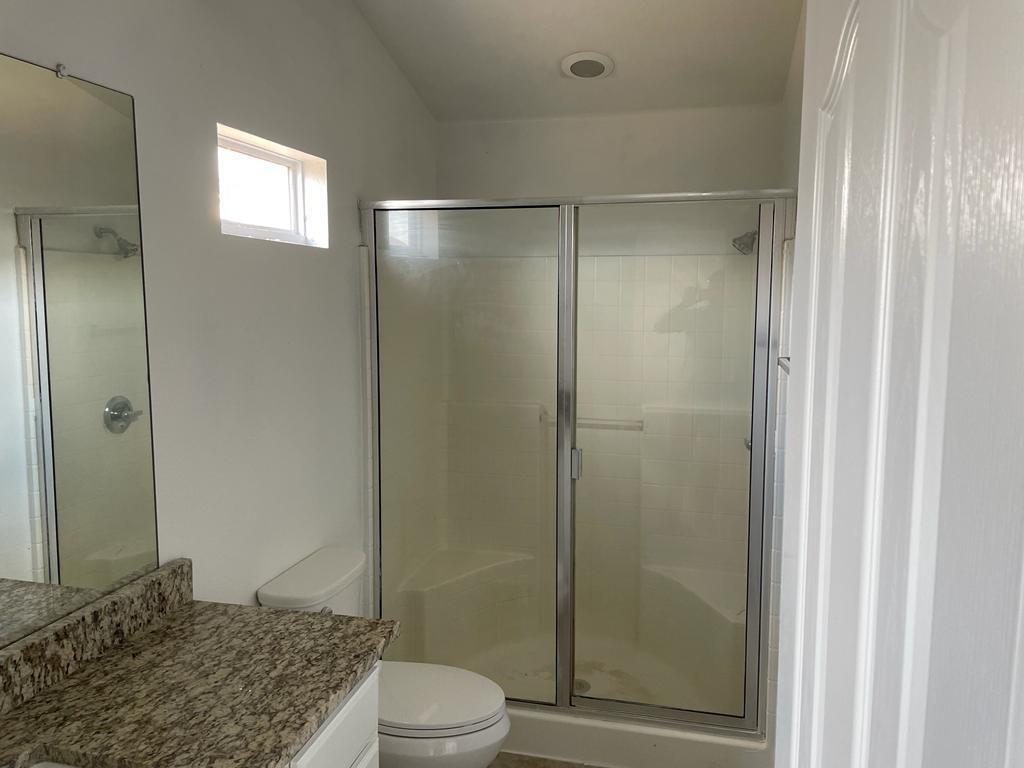 6324 Geneva Lane Fort Worth, TX 76131 - Photo 9 of 18 a bathroom with a shower and a toilet