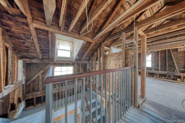 a view of a room with wooden walls