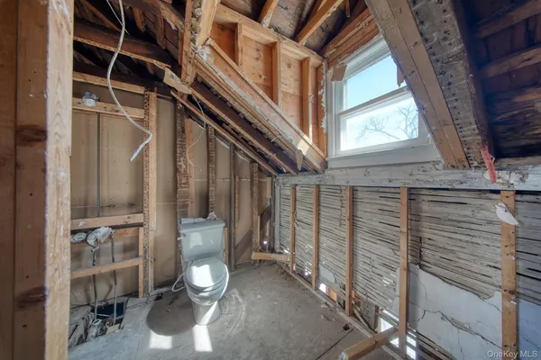 a view of an empty room with windows