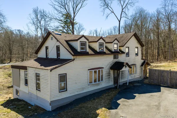a front view of a house with yard