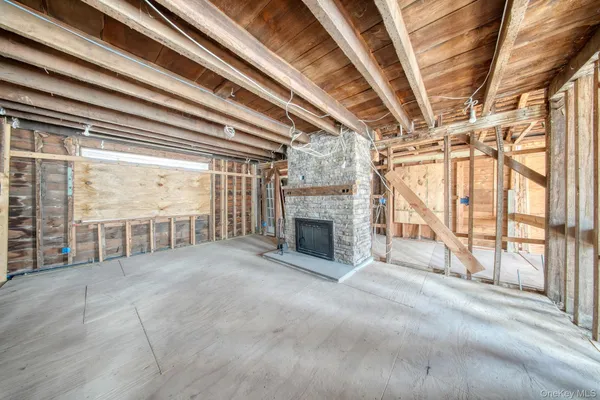 a view of an empty room with a fireplace