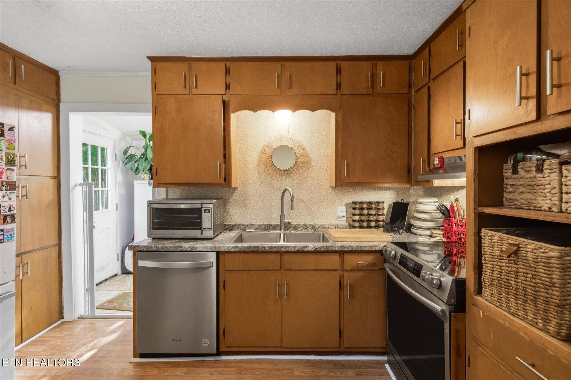 159 Mill Street Delano, TN 37325 - Photo 9 of 22 a kitchen with a sink and a stove