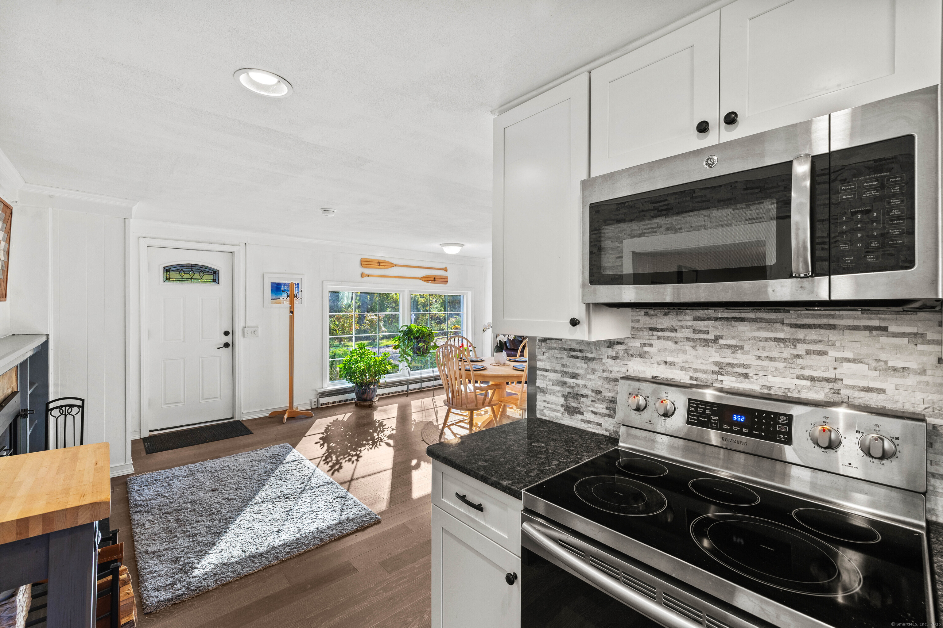 779 Summer Hill Road Madison, CT 06443 - Photo 13 of 40 a kitchen with a stove and a microwave
