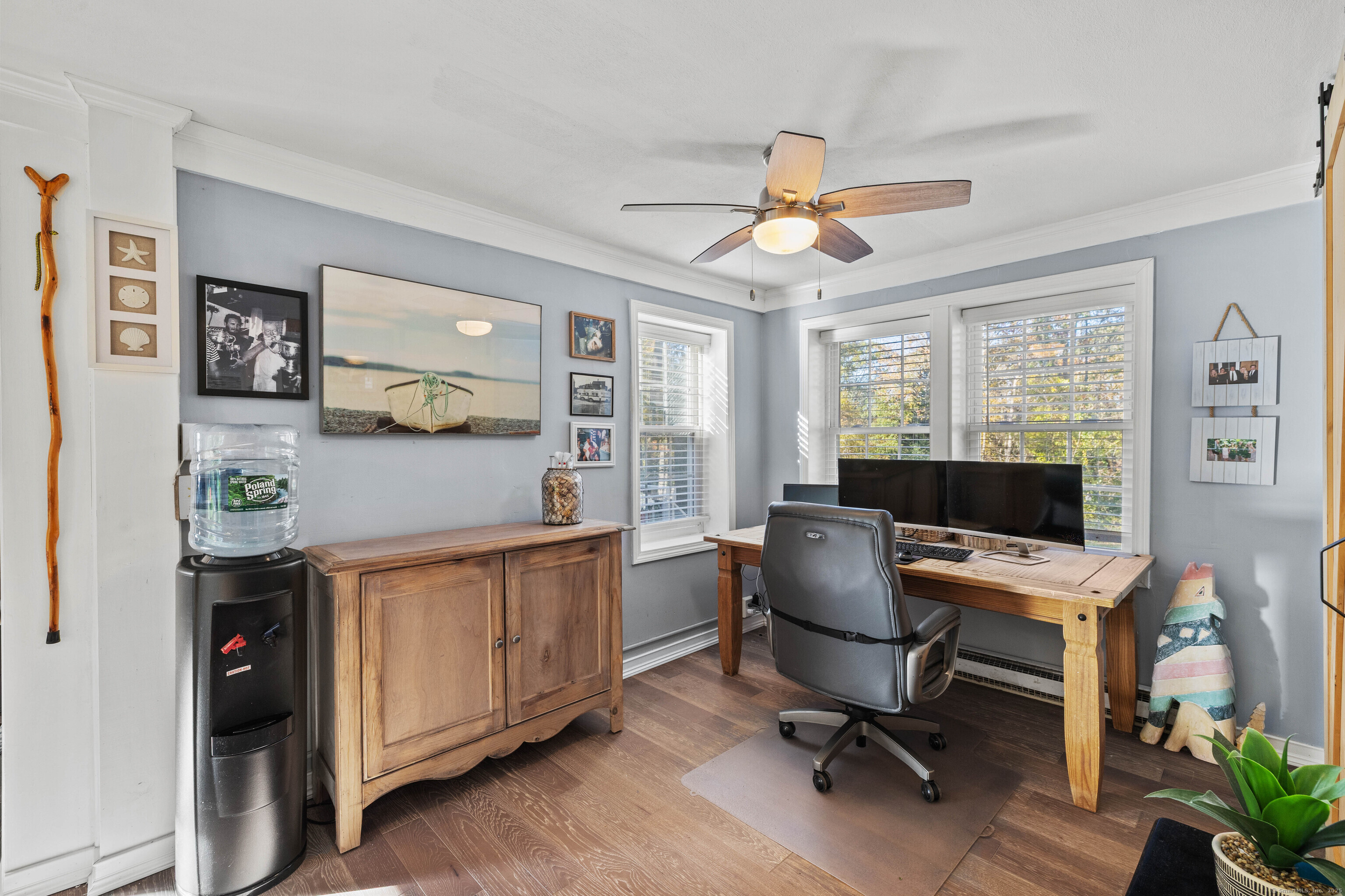 779 Summer Hill Road Madison, CT 06443 - Photo 14 of 40 a view of a workspace with furniture and a window