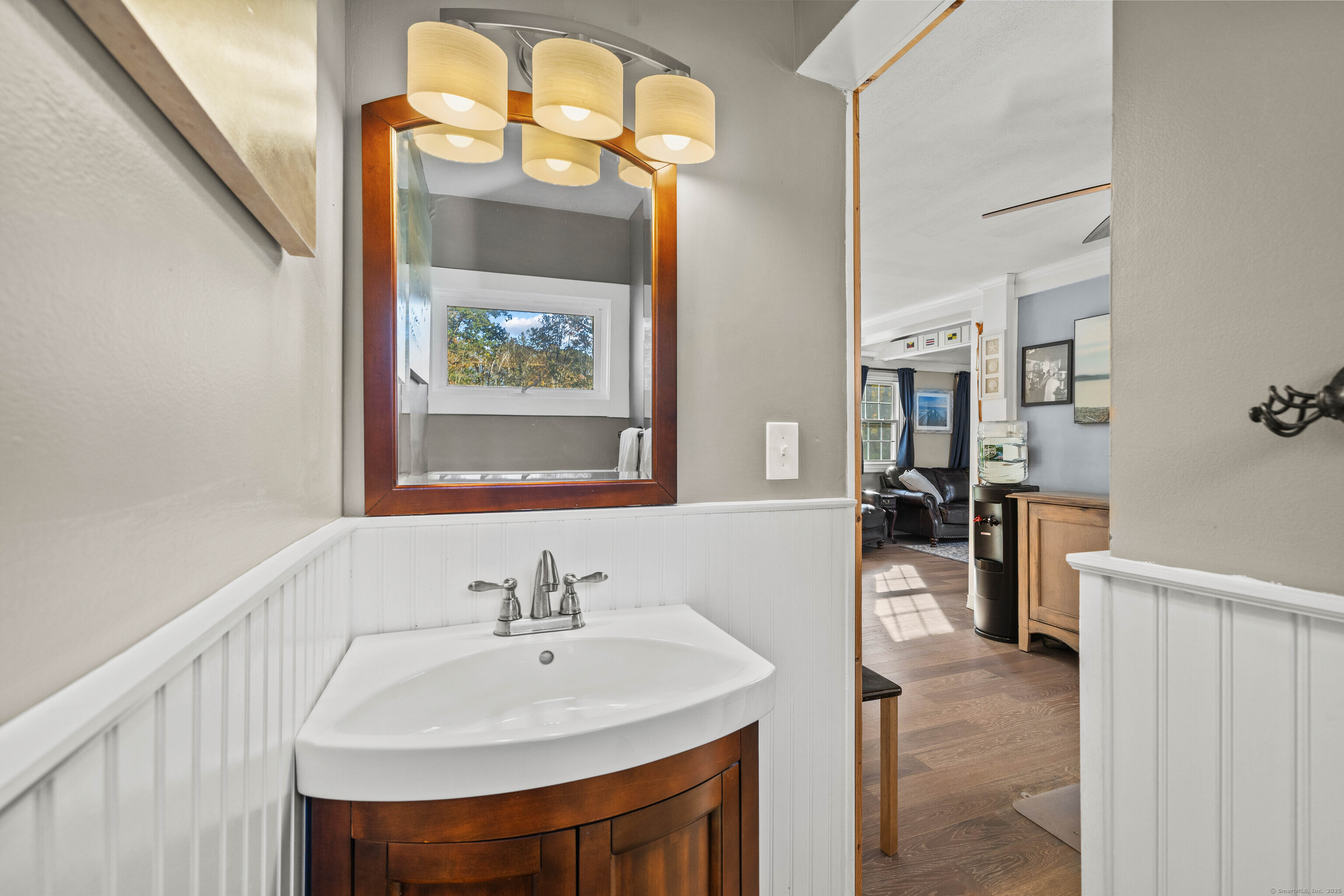 779 Summer Hill Road Madison, CT 06443 - Photo 16 of 40 a en suite bathroom with a sink and a mirror