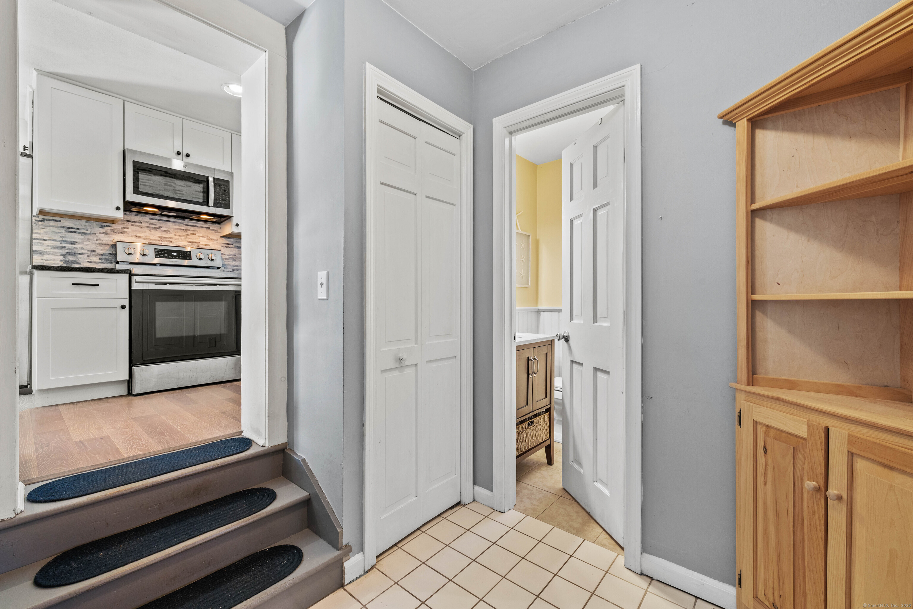 779 Summer Hill Road Madison, CT 06443 - Photo 23 of 40 a kitchen with white cabinets and appliances