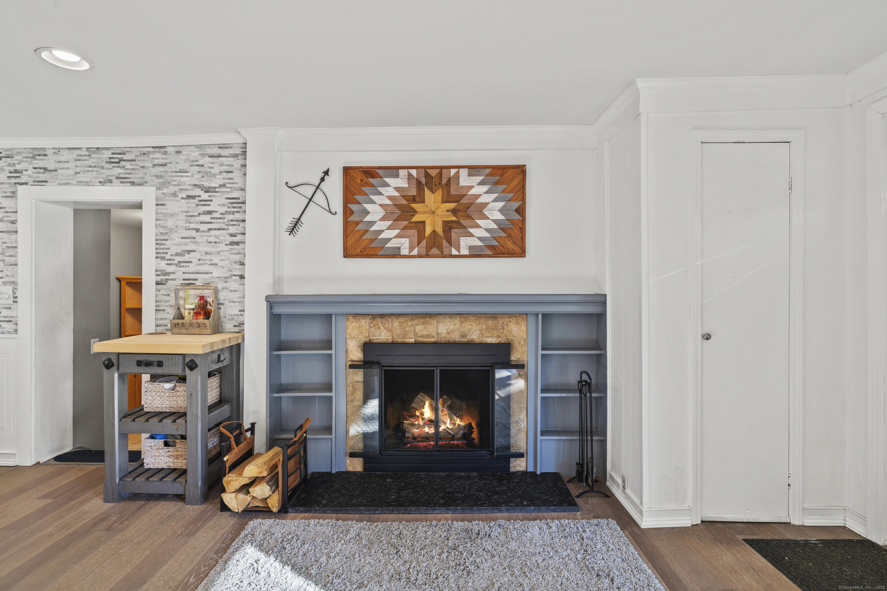 779 Summer Hill Road Madison, CT 06443 - Photo 3 of 40 a living room with furniture and a fireplace