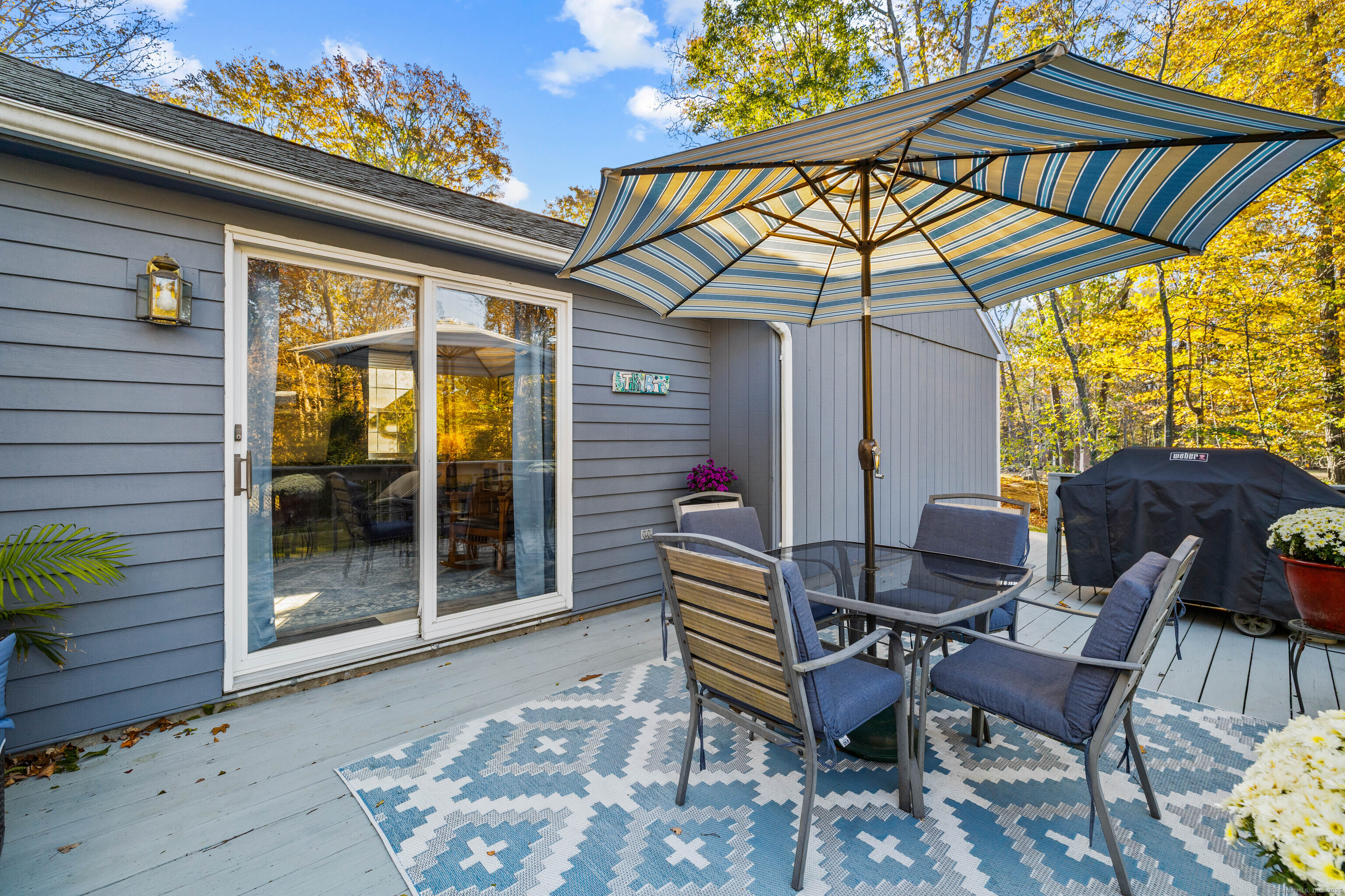 779 Summer Hill Road Madison, CT 06443 - Photo 32 of 40 a backyard of a house with table and chairs