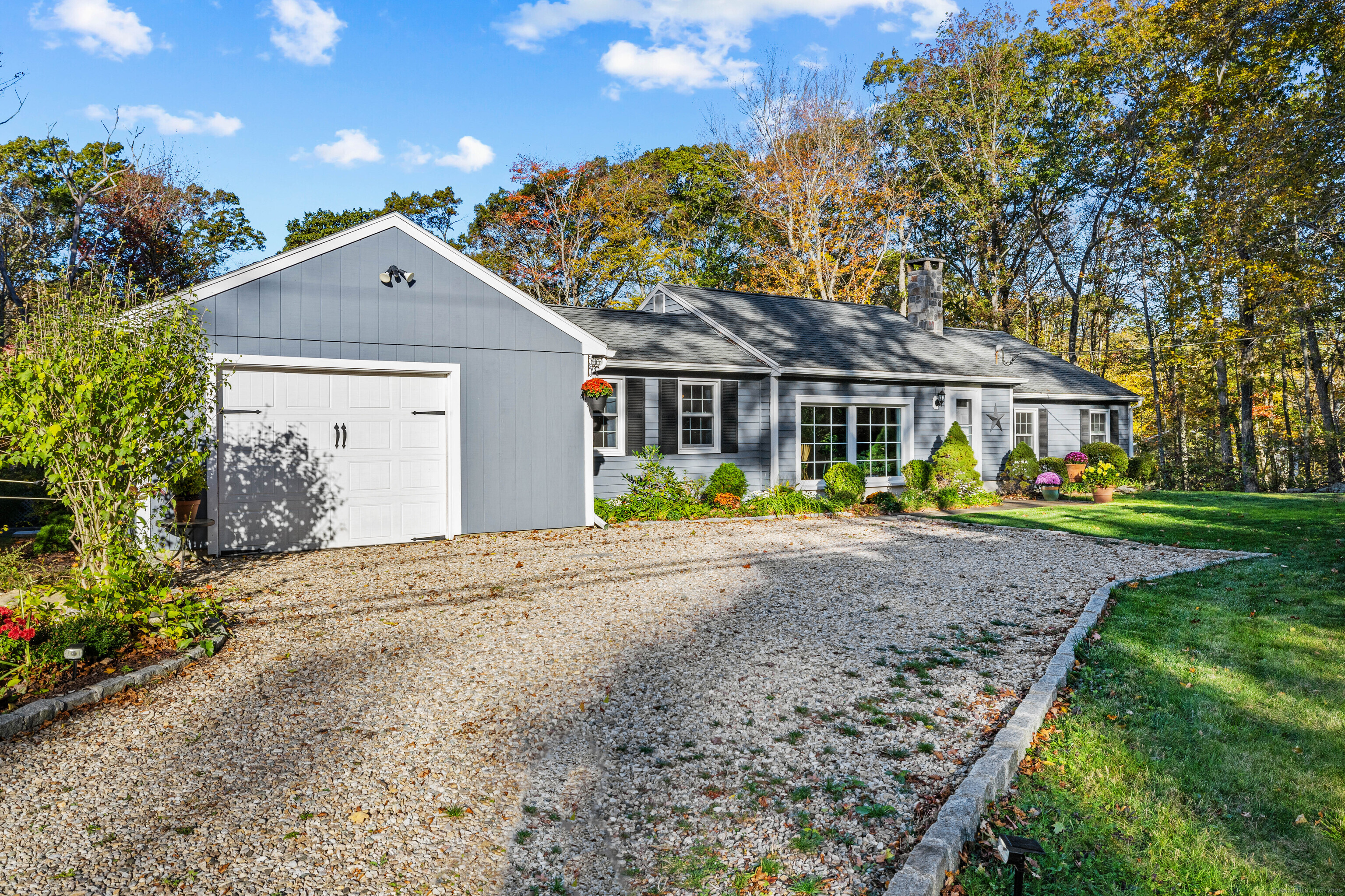 779 Summer Hill Road Madison, CT 06443 - Photo 4 of 40 a view of a house with a yard and plants