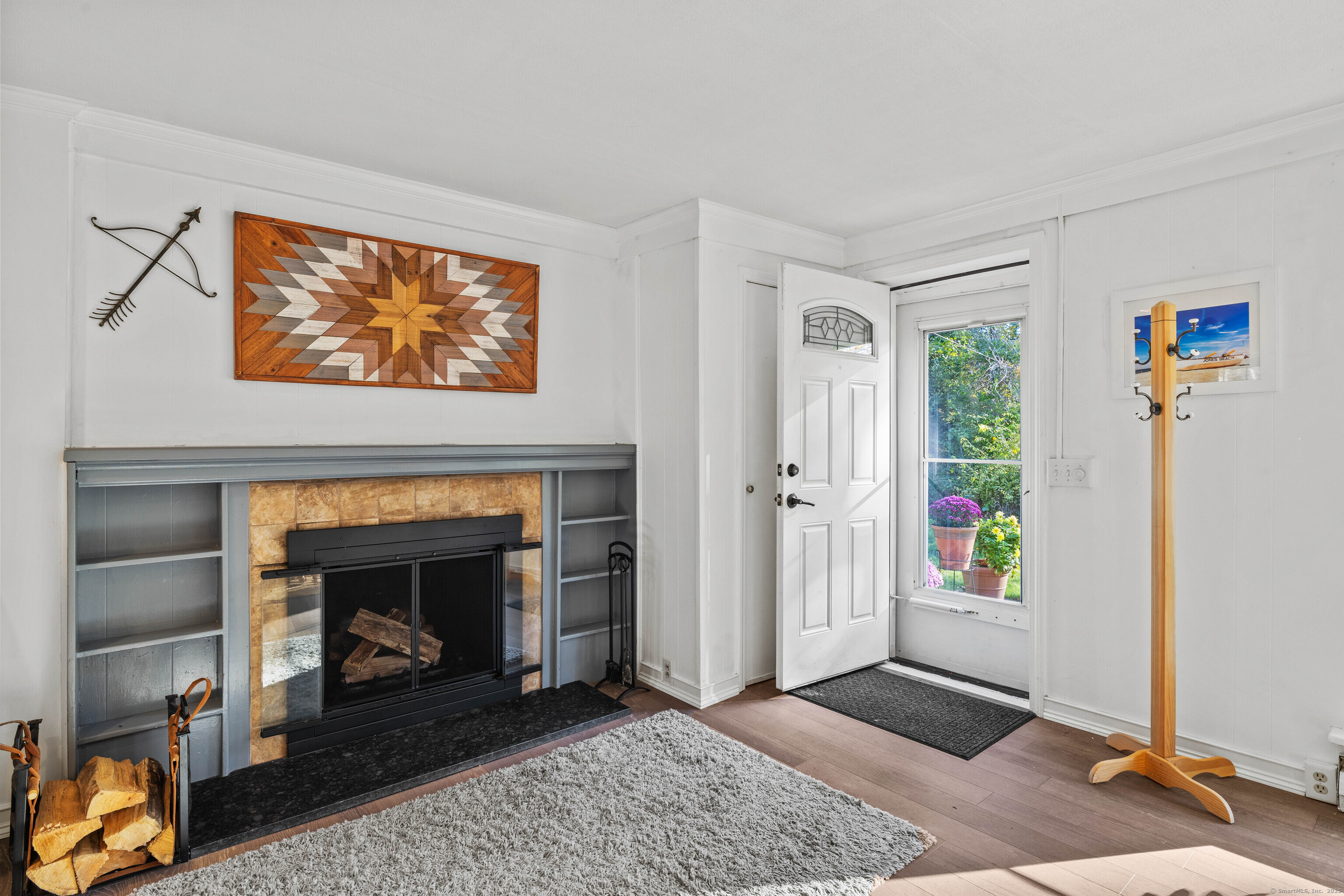 779 Summer Hill Road Madison, CT 06443 - Photo 6 of 40 a view of an empty room with furniture and a fireplace
