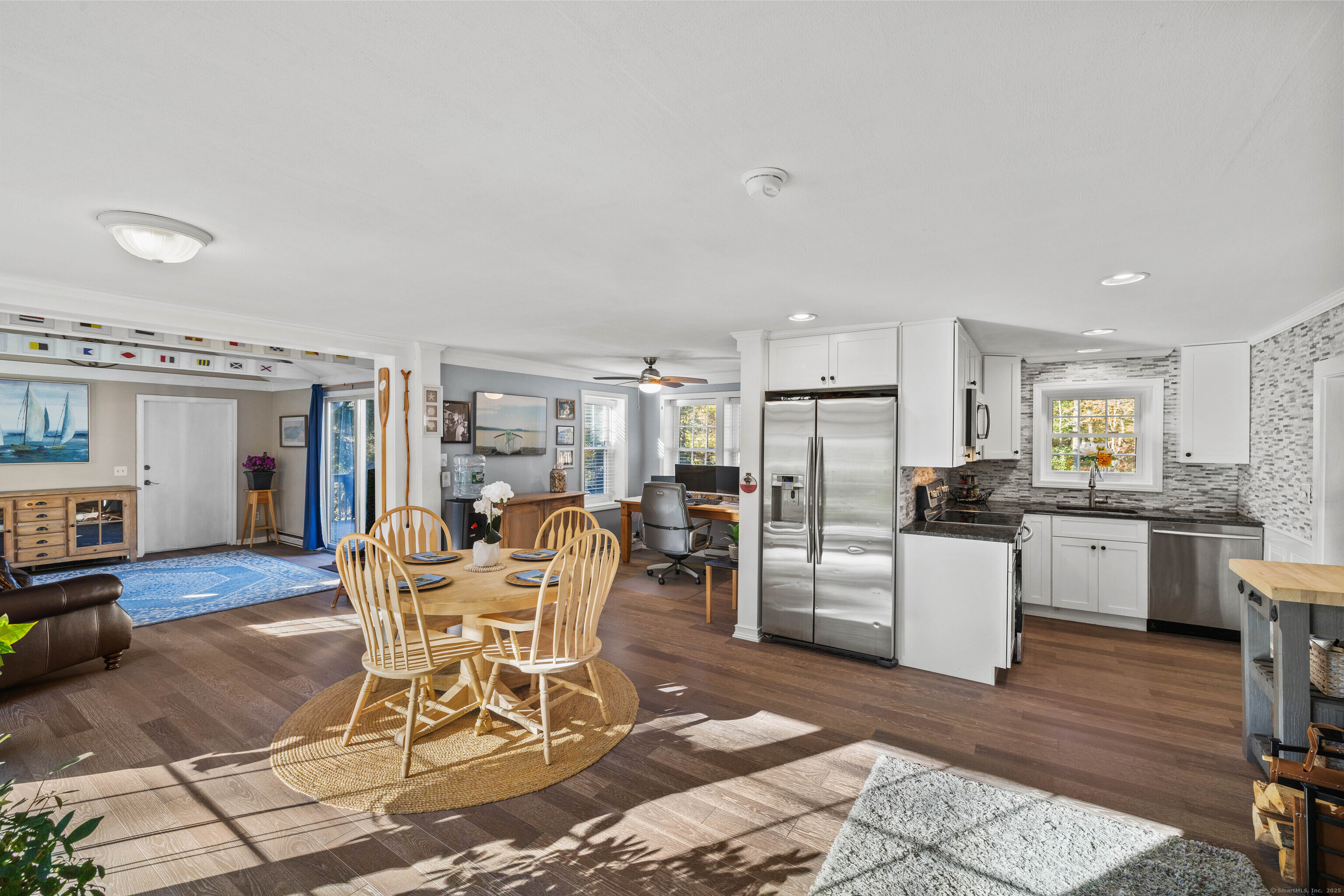 779 Summer Hill Road Madison, CT 06443 - Photo 7 of 40 a dining room with furniture and kitchen view