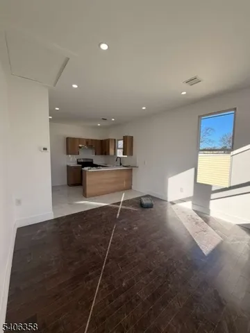 a living room with a furniture and a rug