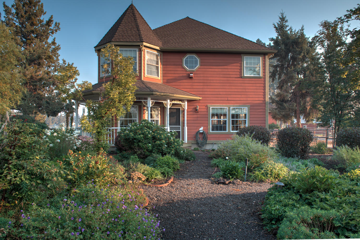 22222 Erickson Road Bend, OR 97701 - Photo 63 of 100 a front view of a house with a yard and garage