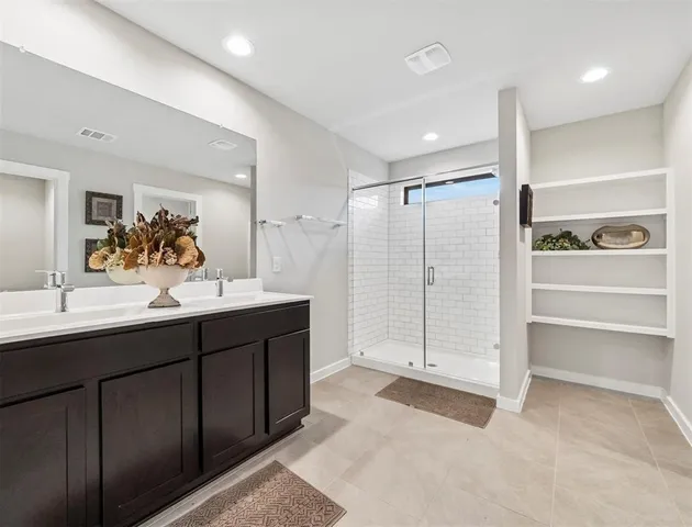 a bathroom with a double vanity sink mirror and double