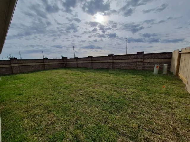 a view of a television with wooden fence