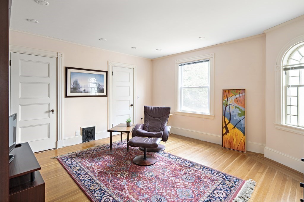 69 Garfield Street Watertown, MA 02472 - Photo 23 of 36 a living room with furniture and a rug