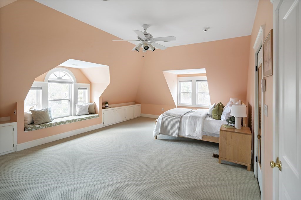 69 Garfield Street Watertown, MA 02472 - Photo 26 of 36 a bedroom with a bed and a large window