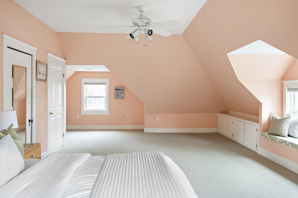 69 Garfield Street Watertown, MA 02472 - Photo 27 of 36 a bedroom with a bed and a couch