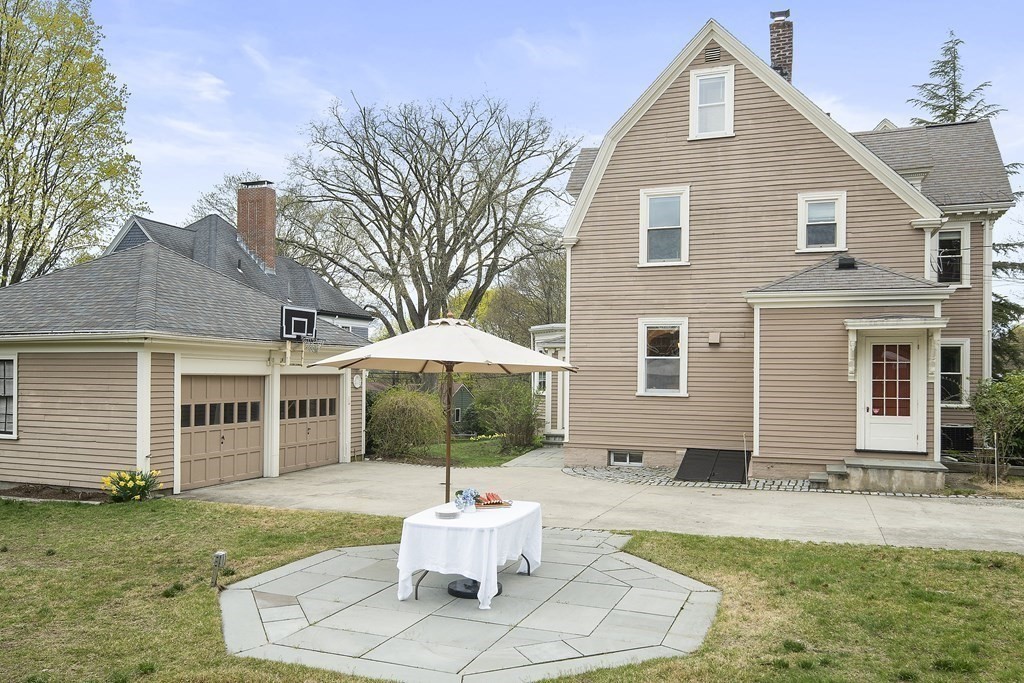 69 Garfield Street Watertown, MA 02472 - Photo 30 of 36 a front view of a house with a yard