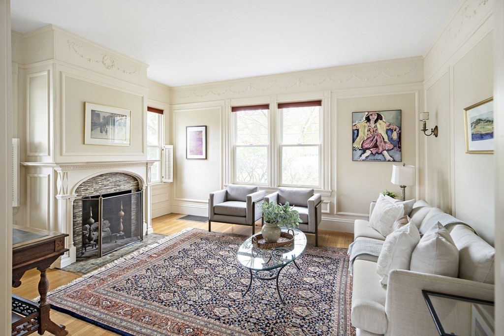 69 Garfield Street Watertown, MA 02472 - Photo 7 of 36 a living room with furniture couches and a fireplace