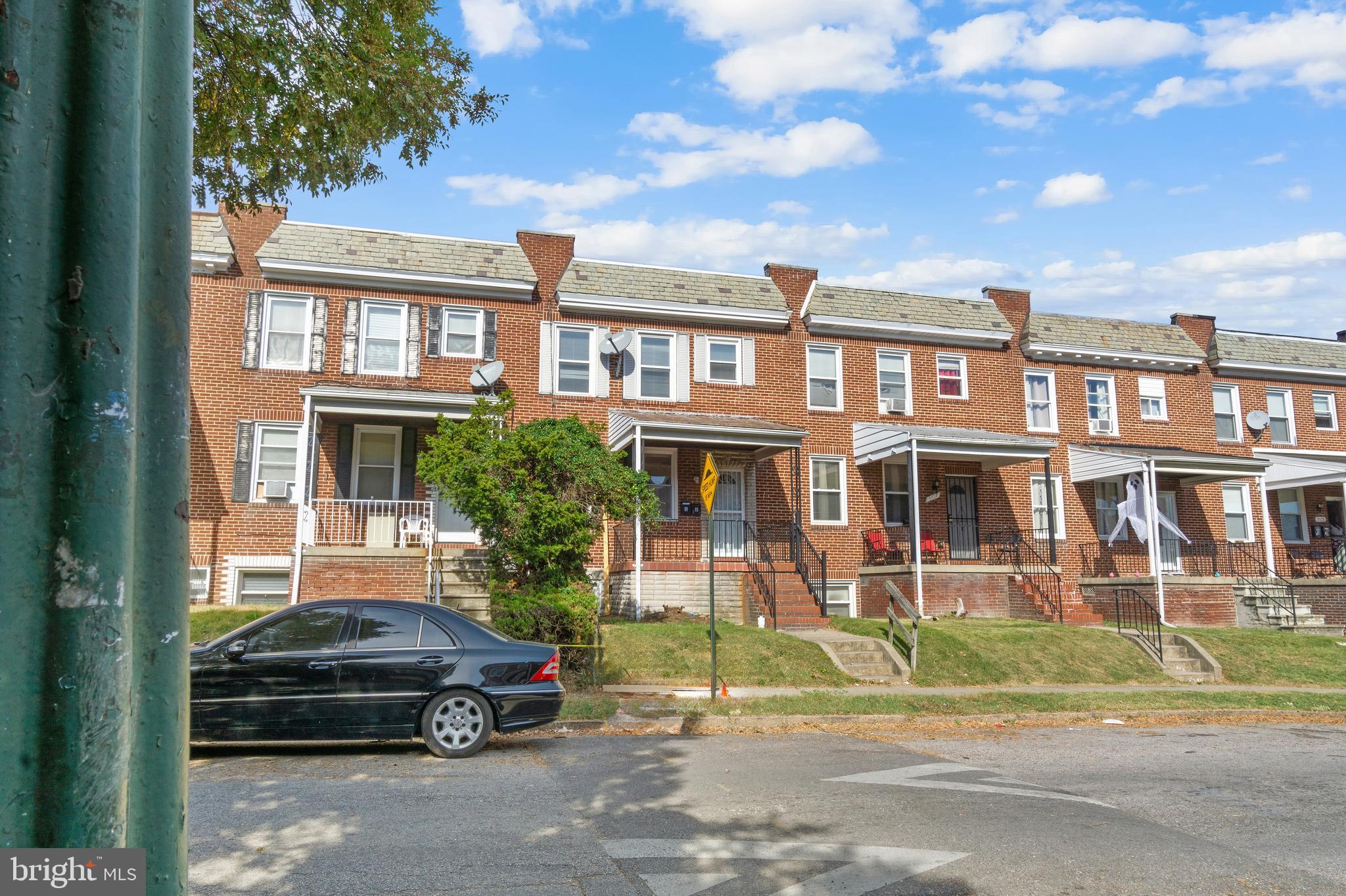 3572 Juneway, Unit 1 Baltimore, MD 21213 - Photo 23 of 23 a car parked in front of a brick house