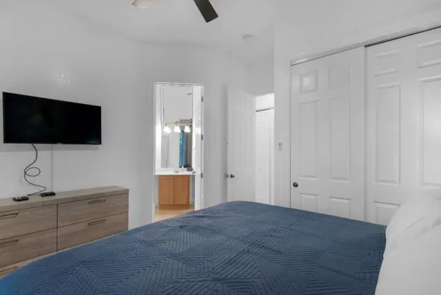 a view of a livingroom with an empty space and a bathroom