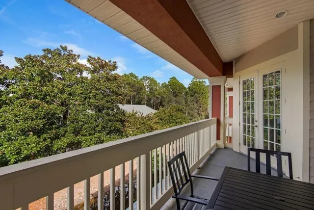 a view of a balcony with wooden floor