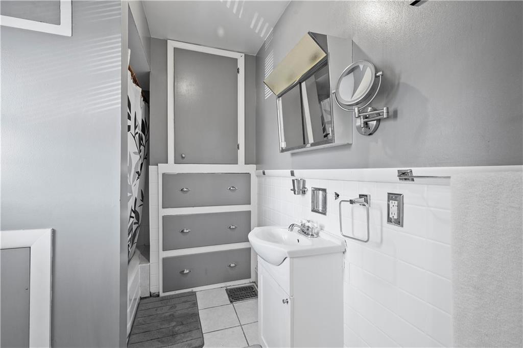 1276 Willowbrook Road Rostraver Township, PA 15012 - Photo 22 of 40 a bathroom with a sink and mirror