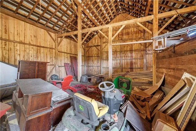 a view of a big room with wooden walls