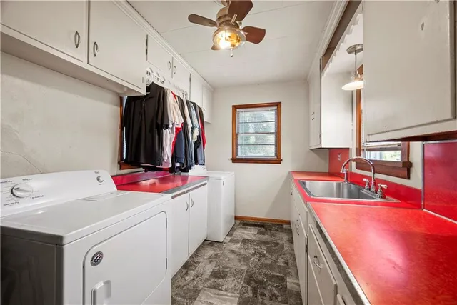 a kitchen with a sink stove and refrigerator