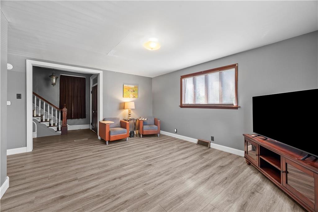 1276 Willowbrook Road Rostraver Township, PA 15012 - Photo 9 of 40 a living room with furniture and a flat screen tv