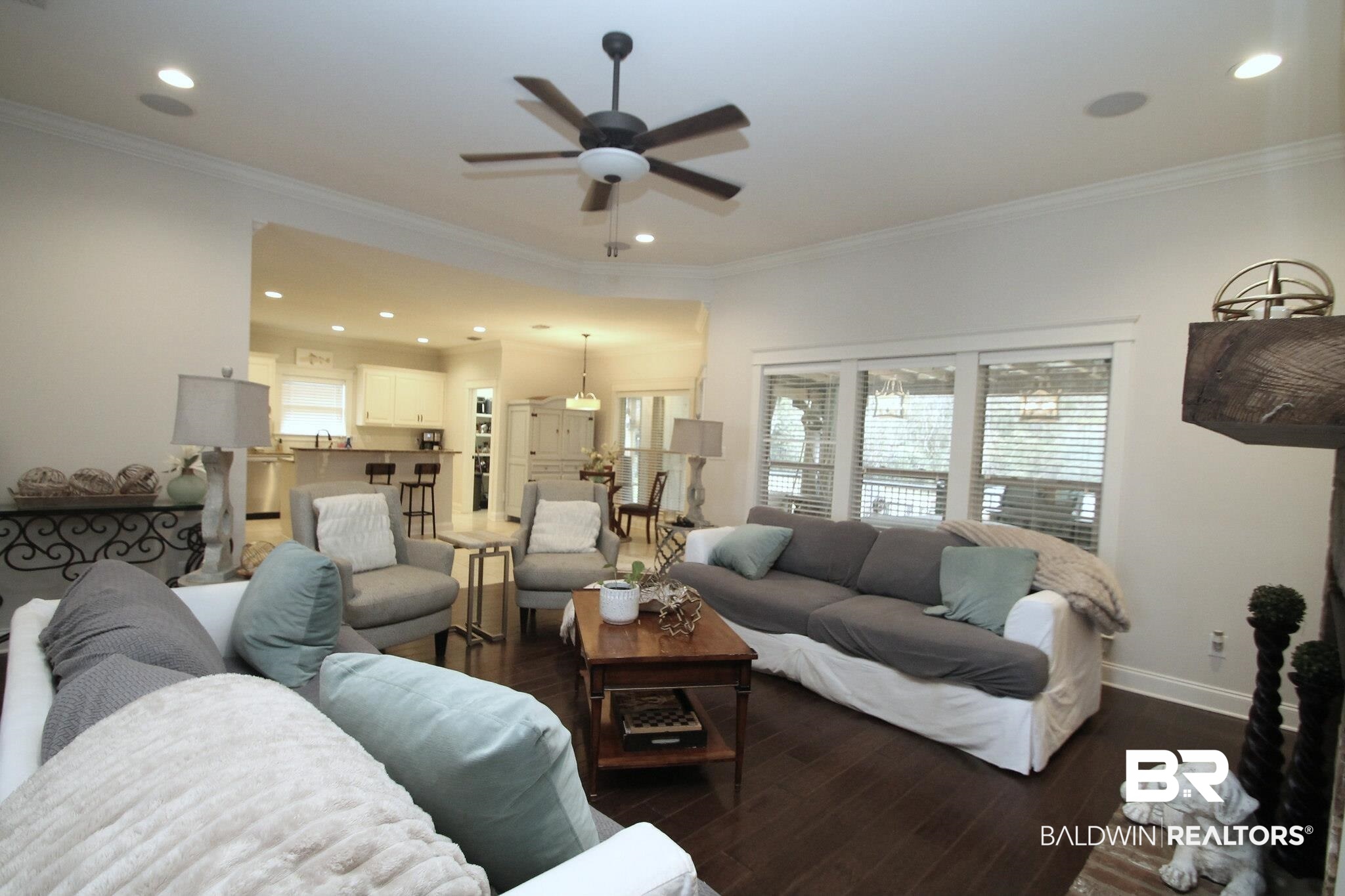 30232 Persimmon Drive Daphne, AL 36527 - Photo 5 of 27 Living area with crown molding, baseboards, dark wood-type flooring, and recessed lighting