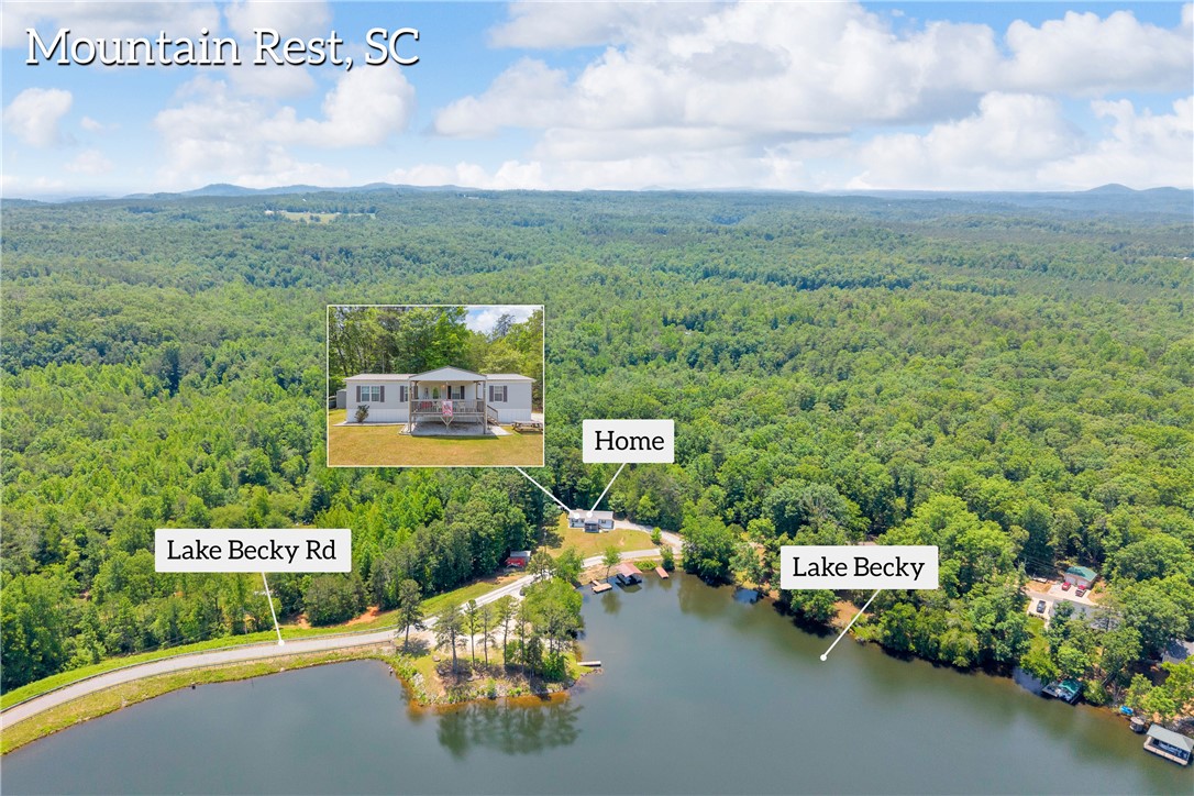 334 Lake Becky Road Mountain Rest, SC 29664 - Photo 2 of 46 Perched by Lake Becky, a tranquil escape awaits, offering natural beauty and serene living.