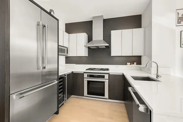 a living room with couch and a large window