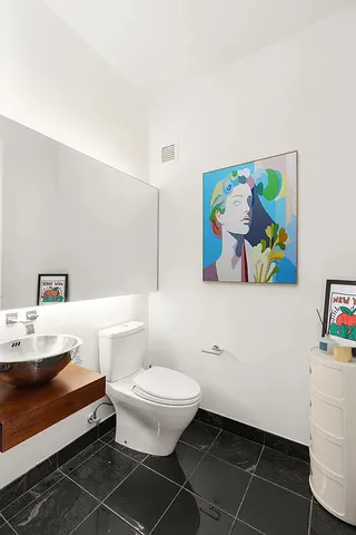 a bathroom with a tub sink and shower