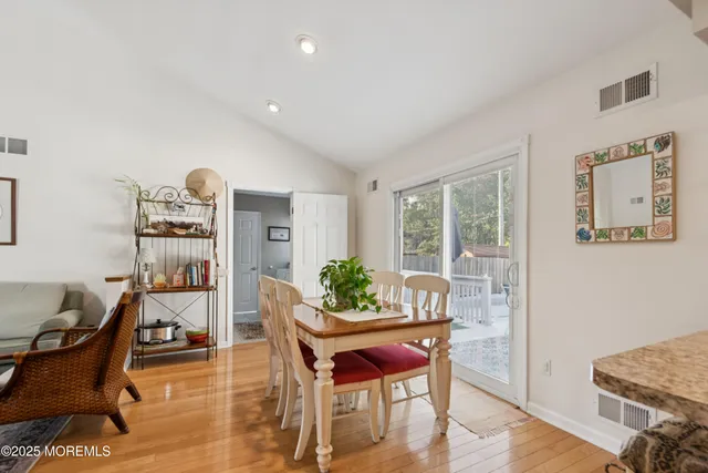 a view of a dining room with furniture and window