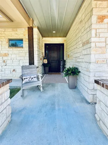 a view of a porch with furniture