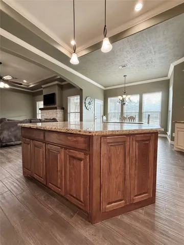 a living room with furniture and a car
