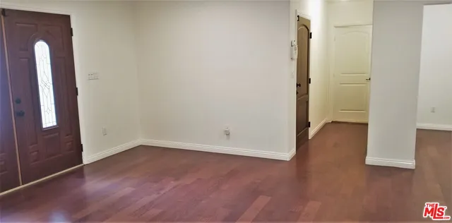 a kitchen with a stove and a refrigerator