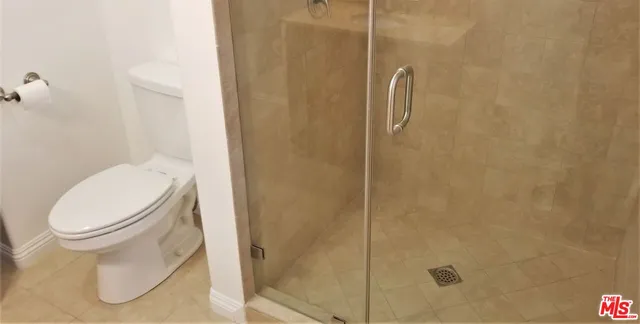 a kitchen with a sink a microwave and cabinets