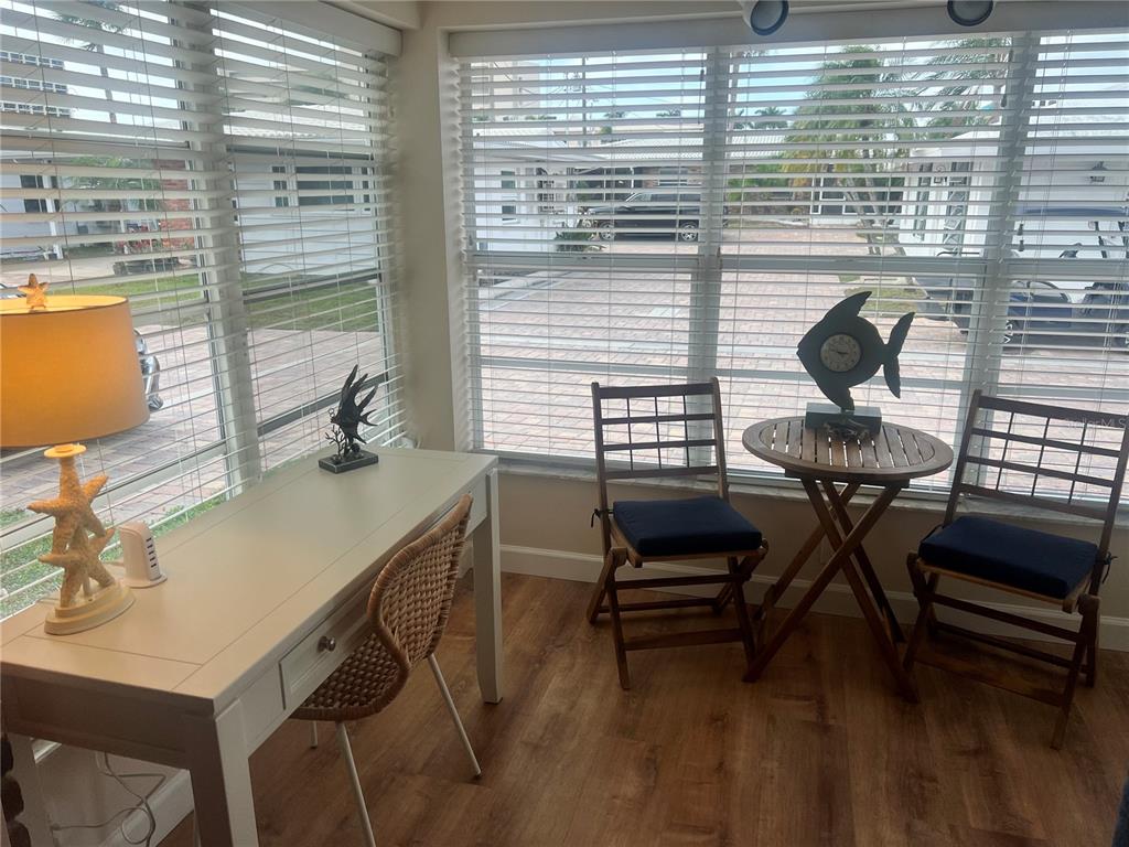 6020 Midnight Pass Road, Unit 38 Sarasota, FL 34242 - Photo 2 of 11 a view of a workspace with furniture and a window